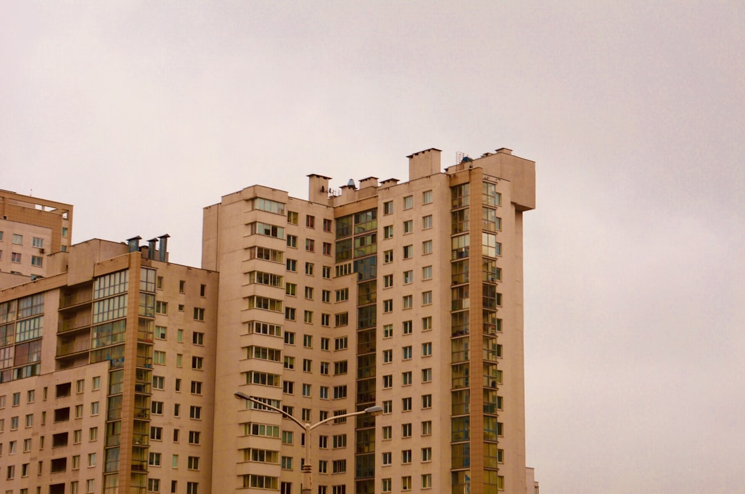brown-and-beige-concrete-building-under-white-sky-qmlok-kqg5k