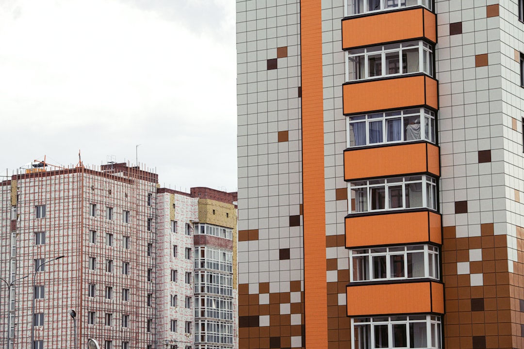 brown-and-white-concrete-building-during-daytime-hhsjzqaufzo